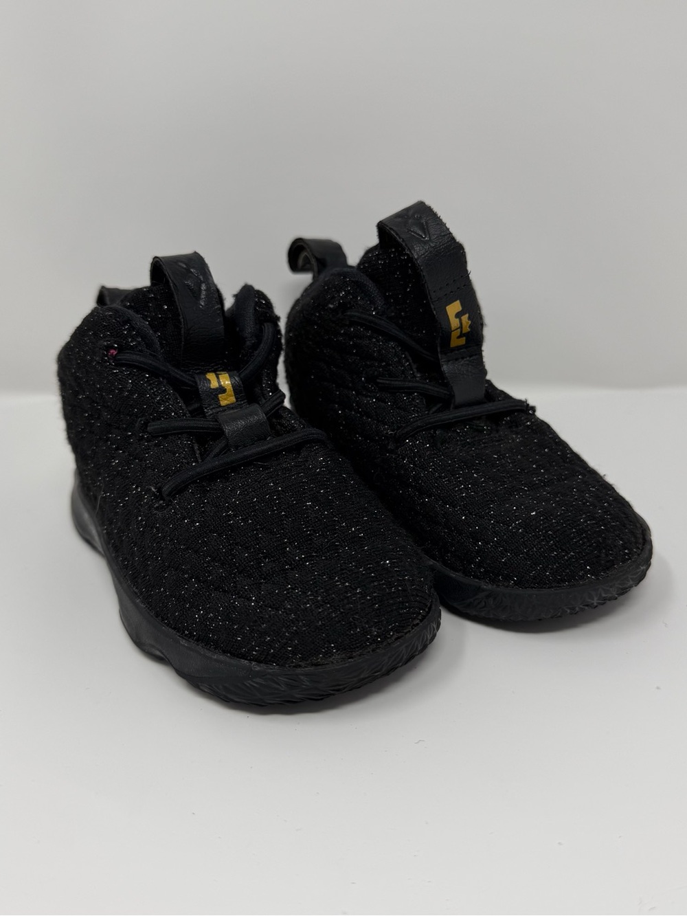 Nike LeBron 15 Metallic Gold Toddler sneakers in black with metallic gold accent